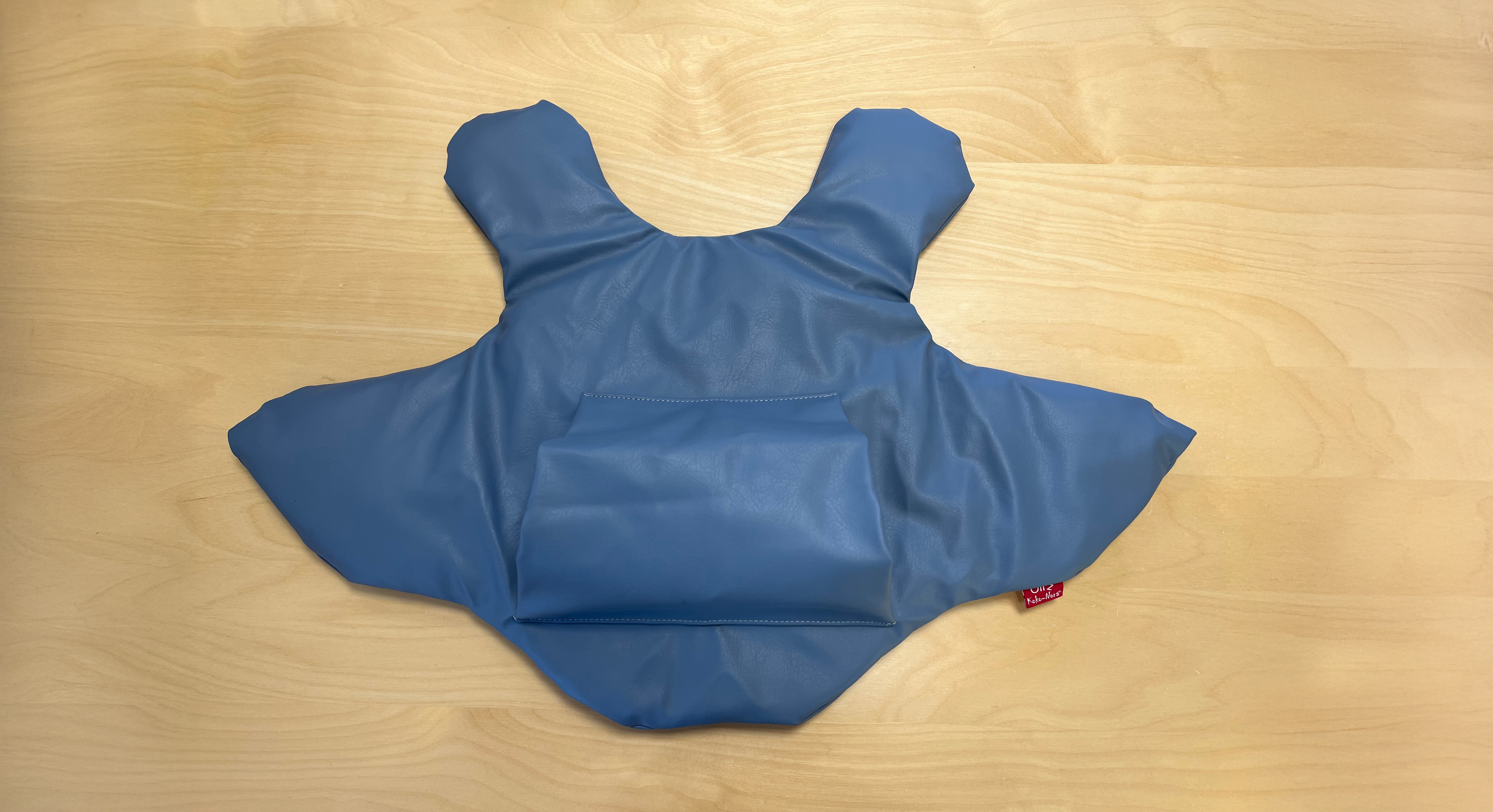 Blå tyngdväst med ficka för händerna